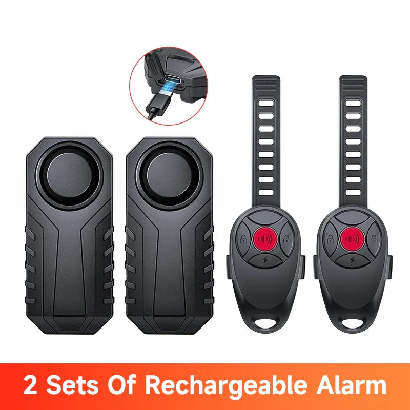 Two sets of rechargeable alarms with remote controls on a white background.