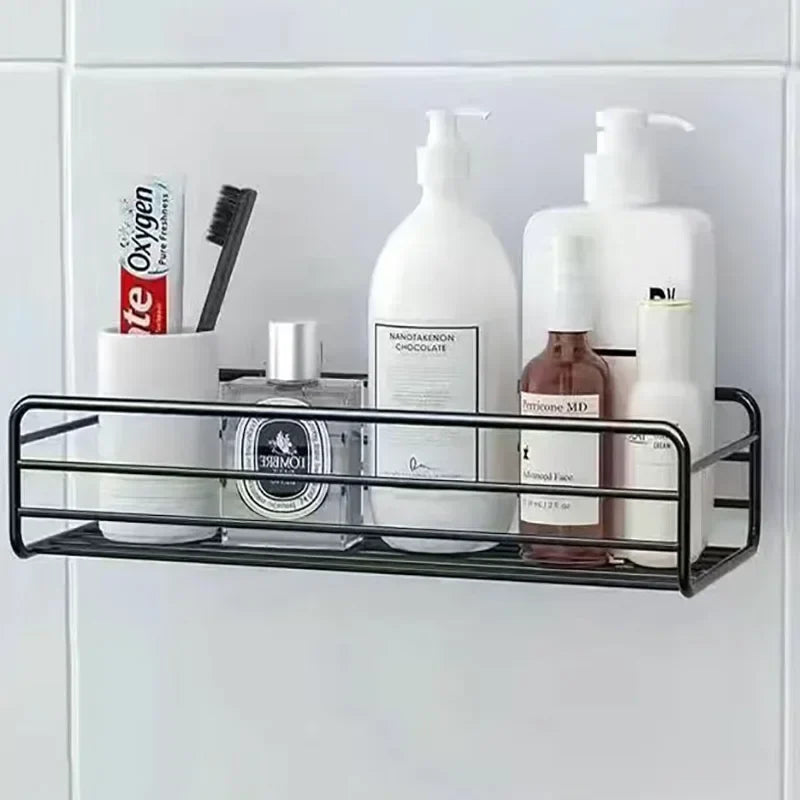 Black metal shelf with bathroom products against a white tiled wall