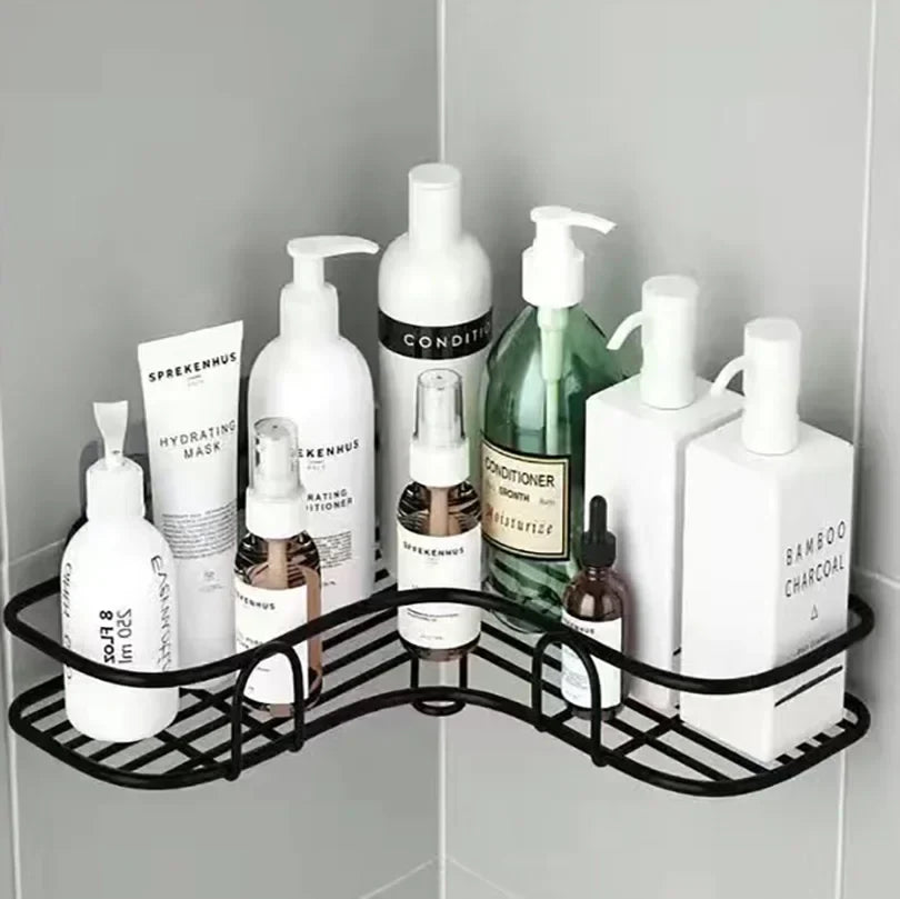 Corner shower caddy with various bottles on a tiled bathroom wall