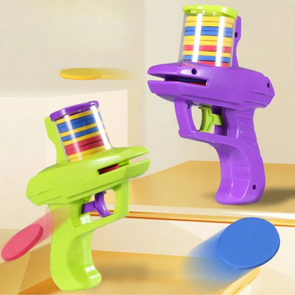 Two colorful toy guns on a reflective surface with a neutral background
