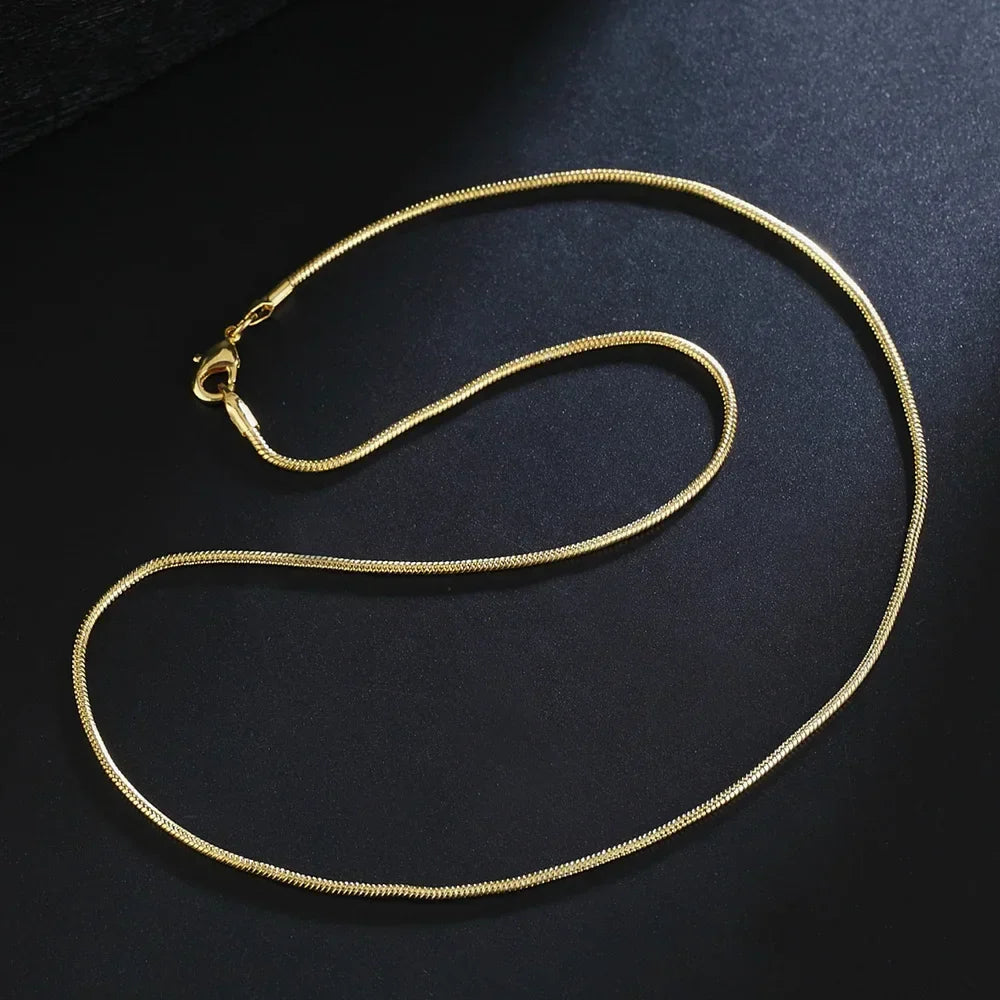 Gold necklace on a black background