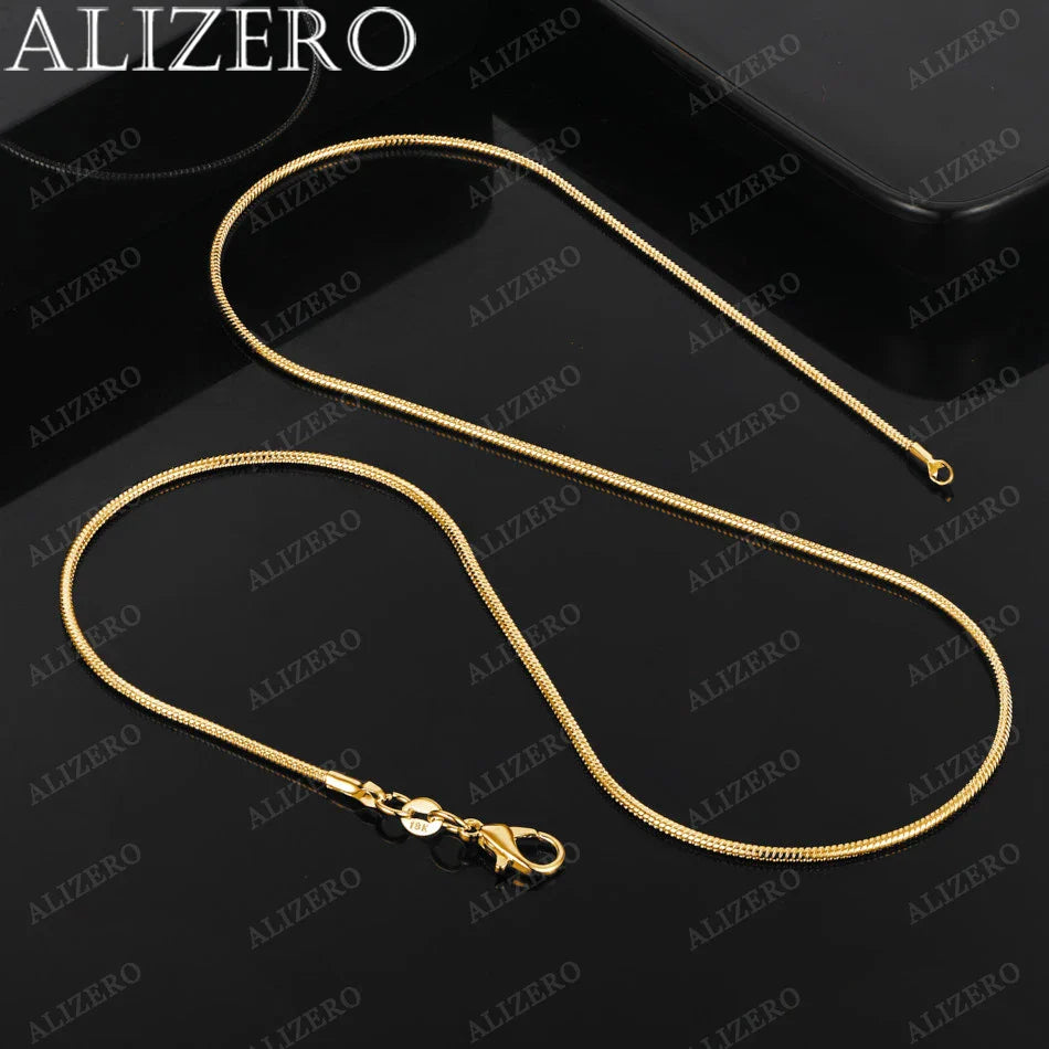 Gold necklace on a black background with ALIZERO branding.