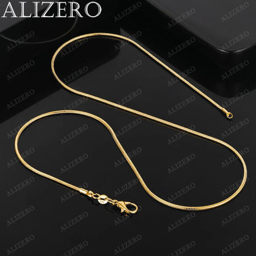 Gold necklace on a black background with ALIZERO branding.