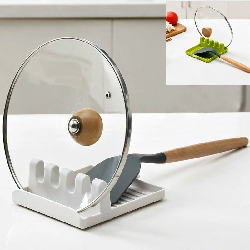 Kitchen utensil holder with a glass lid and wooden handle on a white surface.