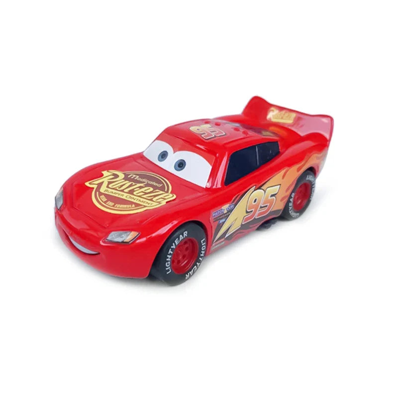 Red toy car with a smiling face on a white background