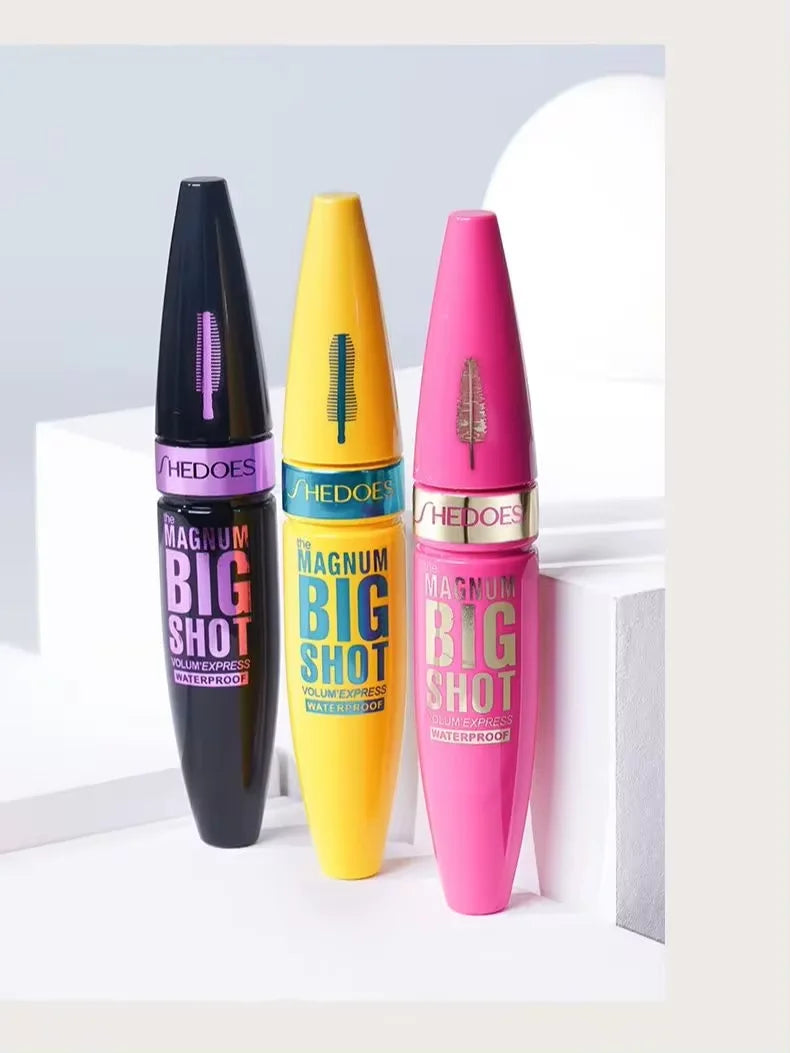 Three colorful mascara bottles with 'MAGNUM BIG SHOT' text on a white background