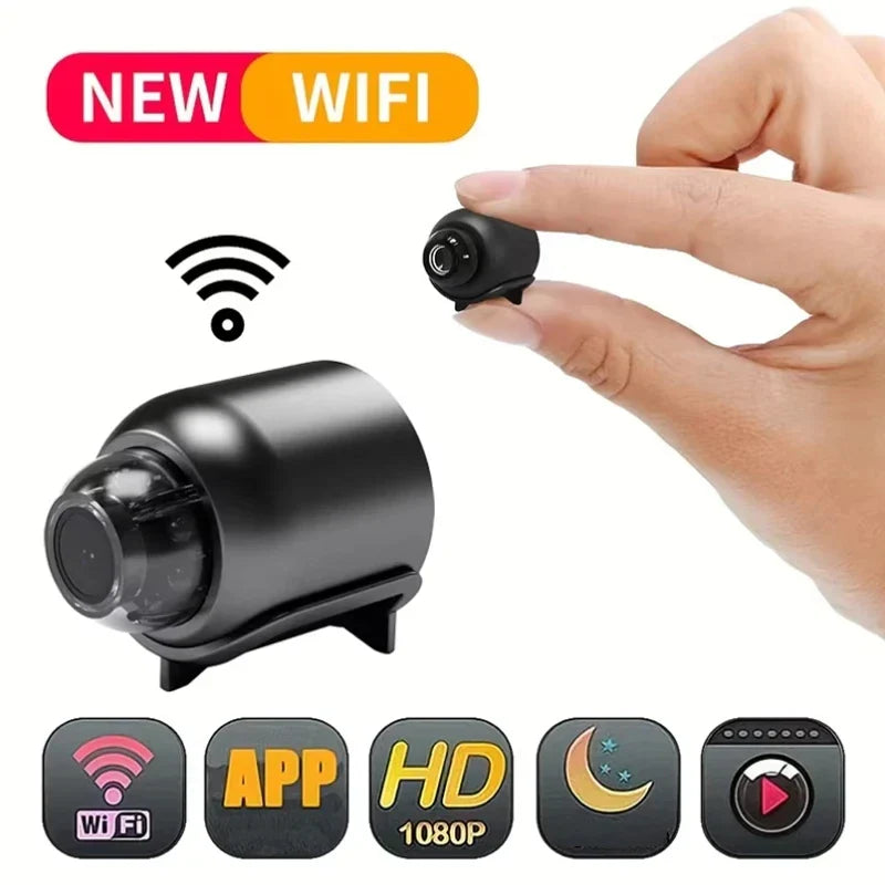 Small black camera with 'NEW WIFI' text, held by a hand, on a white background.