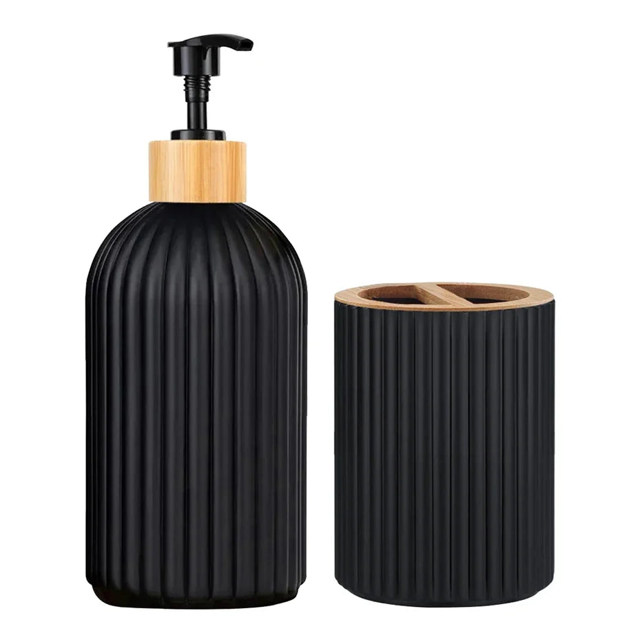 Black ribbed soap dispenser and toothbrush holder set on a white background