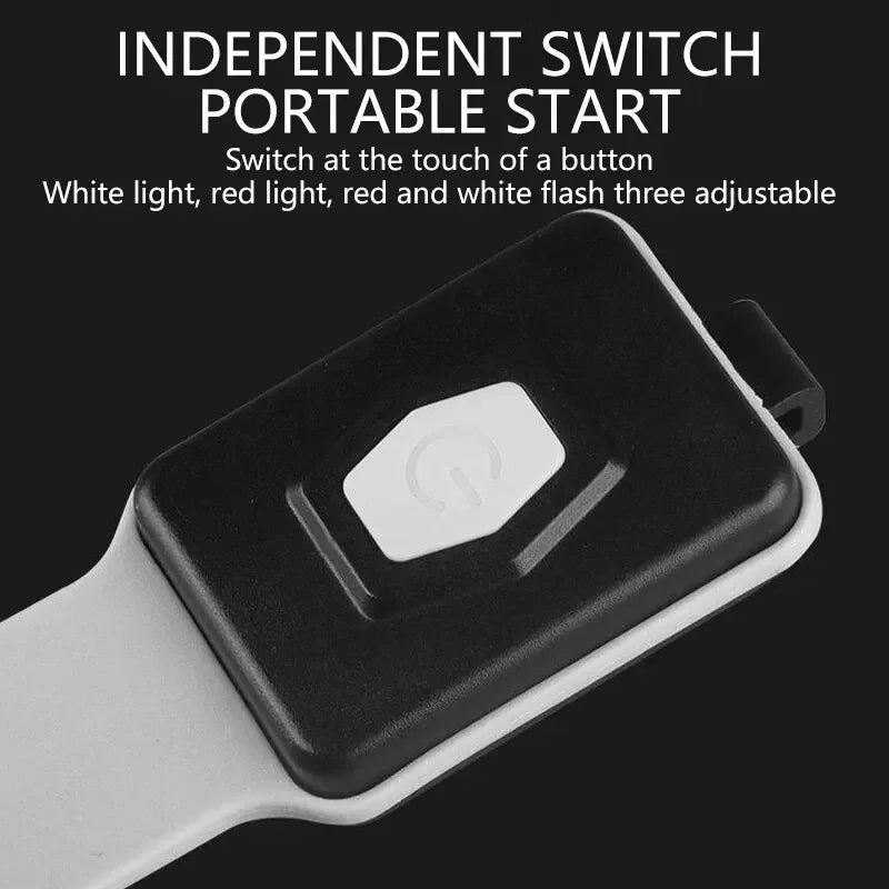 Black and white portable light with button control on a black background