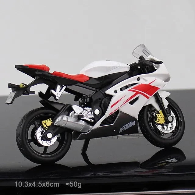 Model motorcycle with red and black design on a gray background