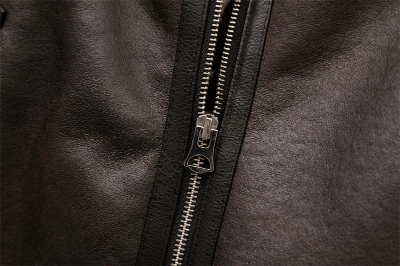 Close-up of a zipper on a dark leather jacket