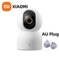 Xiaomi smart camera with AU plug adapter on a white background