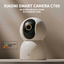 Xiaomi Smart Camera C700 on a neutral background with branding elements.